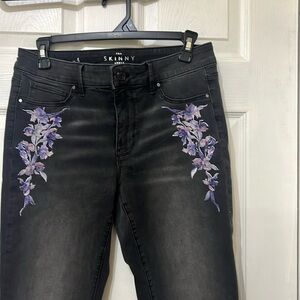 White House Black Market skinny jeans, size 4, with purple embroidering on it